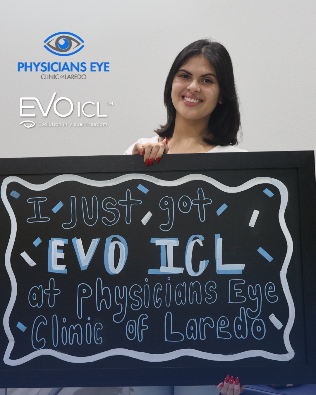 A young Laredo patient holding a chalkboard that reads 'I just got EVO ICL at Physicians Eye Clinic of Laredo'
