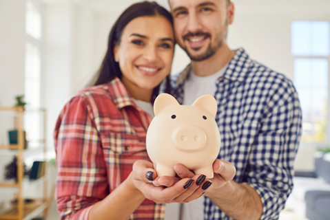 couple holding piggy bank